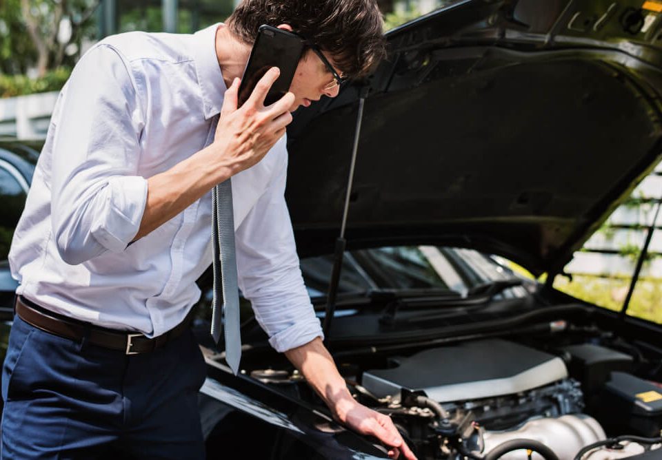 businessman checking his cr due to weird engine noise