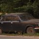 old junk car on the side of the road